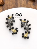 The Dual-Tone Embellished Fish Studs (Onyx Black)