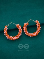 The Beaded Twists - Statement Hoops (Orange-Pink)