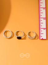  THREE-WAY- SET OF THREE BLACK AND SILVER RINGS