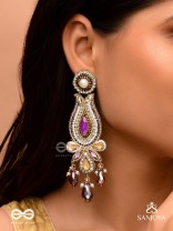Divyaśhobhanā-Divine Splendour-Lotus-inspired embroidered design, adorned with purple and golden gem-studded motifs, Pearl and Beads.