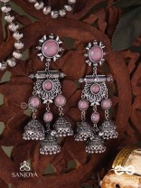 VIJAYAMUKTA-VICTORY PEARLS- REGAL OXIDIZED EARRINGS WITH A CENTRAL PURPLE STONE AND LAYERED JHUMKAS