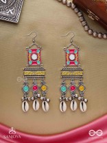 SINGHASANAMUKTA- THRONE GEM- OXIDIZED ENAMELLED EARRINGS IN MULTICOLOUR MOTIFS WITH GHUNGHROO'S AND COWRIE SHELLS