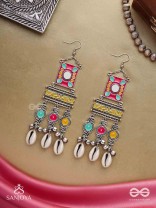 SINGHASANAMUKTA- THRONE GEM- OXIDIZED ENAMELLED EARRINGS IN MULTICOLOUR MOTIFS WITH GHUNGHROO'S AND COWRIE SHELLS