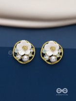 Divine temptation- white floral studs encircled with golden mesh 
