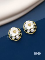 Divine temptation- white floral studs encircled with golden mesh 