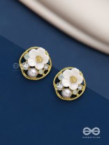 Divine temptation- white floral studs encircled with golden mesh 