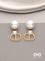 Starlit orb- dangling pearl earrings with golden spheres 