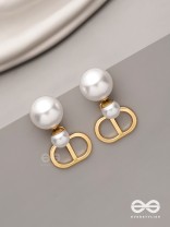 Starlit orb- dangling pearl earrings with golden spheres 
