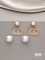 Starlit orb- dangling pearl earrings with golden spheres 