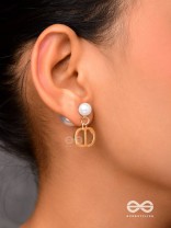 Starlit orb- dangling pearl earrings with golden spheres 