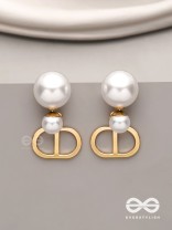 Starlit orb- dangling pearl earrings with golden spheres 
