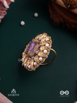KANAKA PUSHPA – GOLDEN FLOWER EMBROIDERED FLOWER-SHAPED RING ADORNED WITH YELLOW GEMS AND PEARLS, GIVING A GOLDEN GLOW