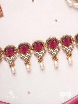PREMABHUSHANAM - ADORNMENT OF LOVE - RED ENAMEL ON STONES, PEARLS AND KUNDAN DETAILING CHOKER NECKLACE