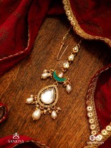RATNODYA - RISING GEM - DAZZLING KUNDAN MAANGTIKA WITH PEARLS AND ROYAL GREEN AND GOLD ACCENTS