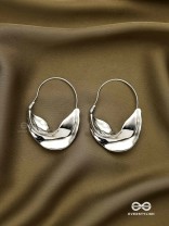 SILVER DRIFT- SCULPTED SILVER HOOPS WITH A FLUID