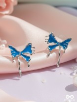 FROSTY FLING – PLAYFUL BLUE BOW EARRINGS