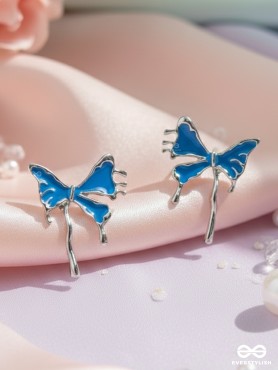 FROSTY FLING – PLAYFUL BLUE BOW EARRINGS