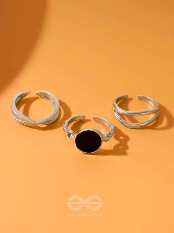  THREE-WAY- SET OF THREE BLACK AND SILVER RINGS
