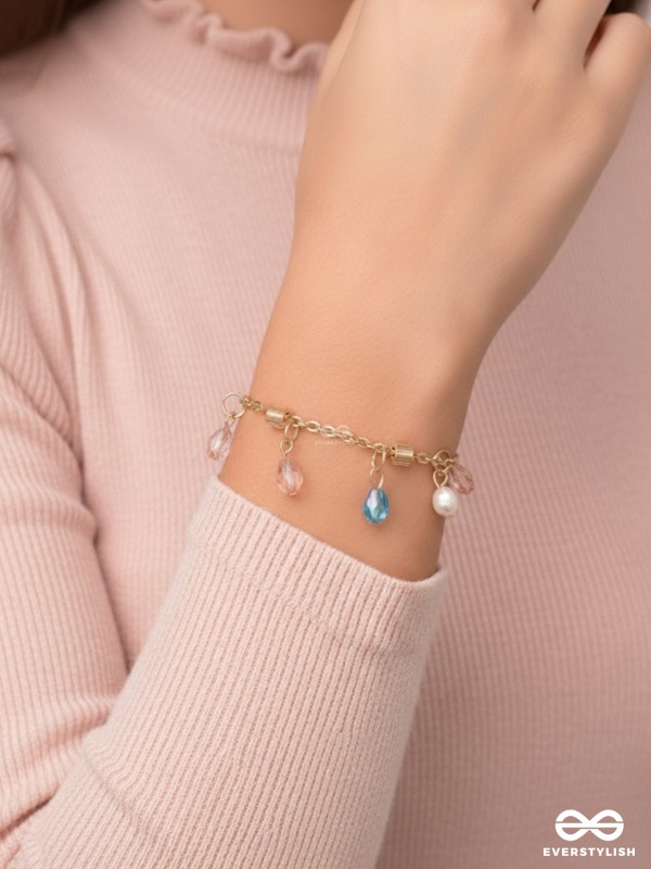 The Shimmering Sleet- Pearl and Crystals Studded Golden Bracelet