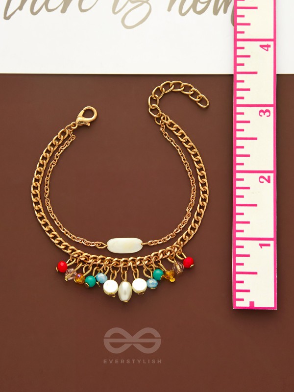 The Divine Galaxy- Pearls and Beads Studded Golden Bracelet