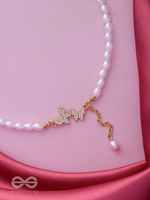 TWO TINY AVIATORS - GOLDEN PEARL NECKPIECE