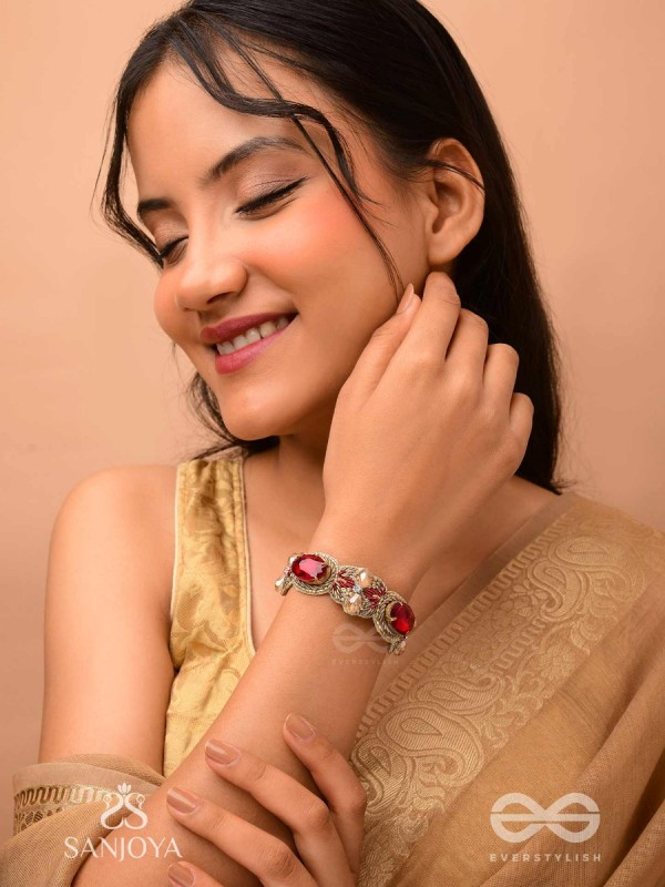 Sundarasūra- Beautiful Wine- Bracelet with rich hue of the red stones and twisted thread work.