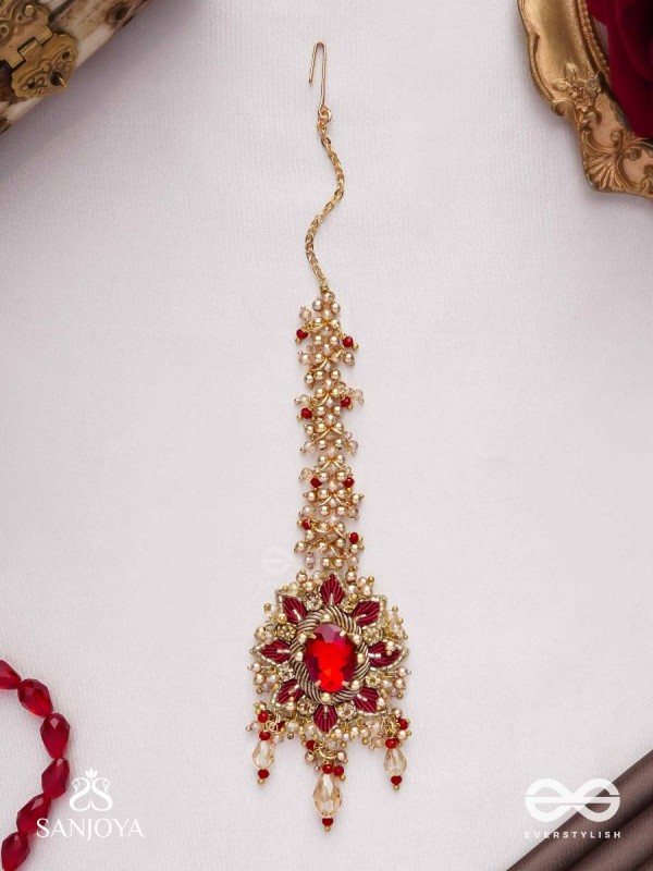 Kumudinikunda-Delicate lotus-Embroidered hair accessory with a red stone & golden embellishments
