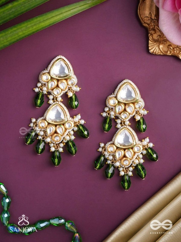 Kundalāṅgī-Kundan Elegance- Traditional pearl and Kundan earrings adorned with beads, stones, and green danglers for a regal touch.