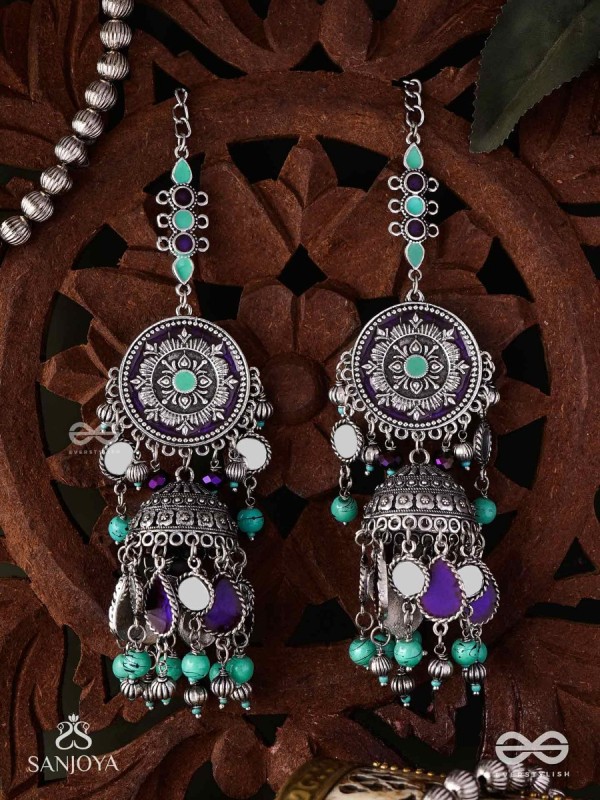 RATNA TILAKA-JEWEL ADORNMENT- EARRINGS ENAMELLED IN SHADES OF BLUE AND BLACK, ACCENTED WITH GHUNGROO BEADS AND OXIDIZED JHUMKI