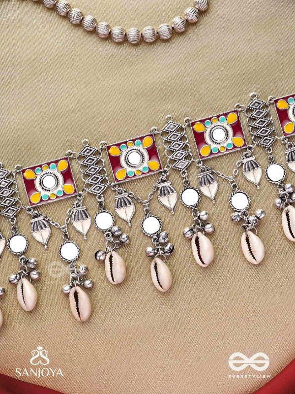  SANGRAHITAVARNA- COLLECTED HUES- ENAMELLED OXIDIZED CHOKER NECKPIECE IN PASTEL HUES WITH COWRIE SHELLS, GHUNGROOS AND MIRRORWORK