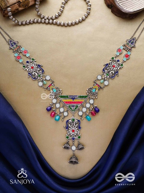 Prema raga- Love colour- Enamelled oxidized neckpiece embellished with beads, mirror and dangling jhumka.