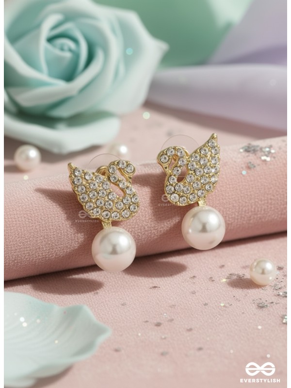 CELESTE SWAN – RADIANT WINGED STUDS WITH A CLASSIC PEARL DROP