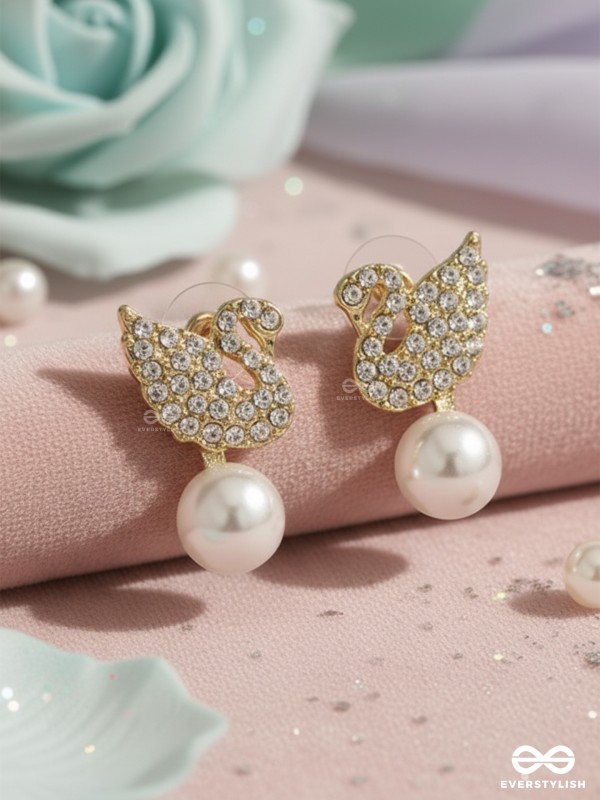 CELESTE SWAN – RADIANT WINGED STUDS WITH A CLASSIC PEARL DROP