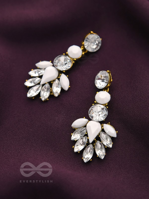 The pious touch white enigmatic stones studded earrings 