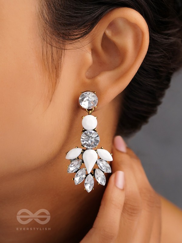 The pious touch white enigmatic stones studded earrings 