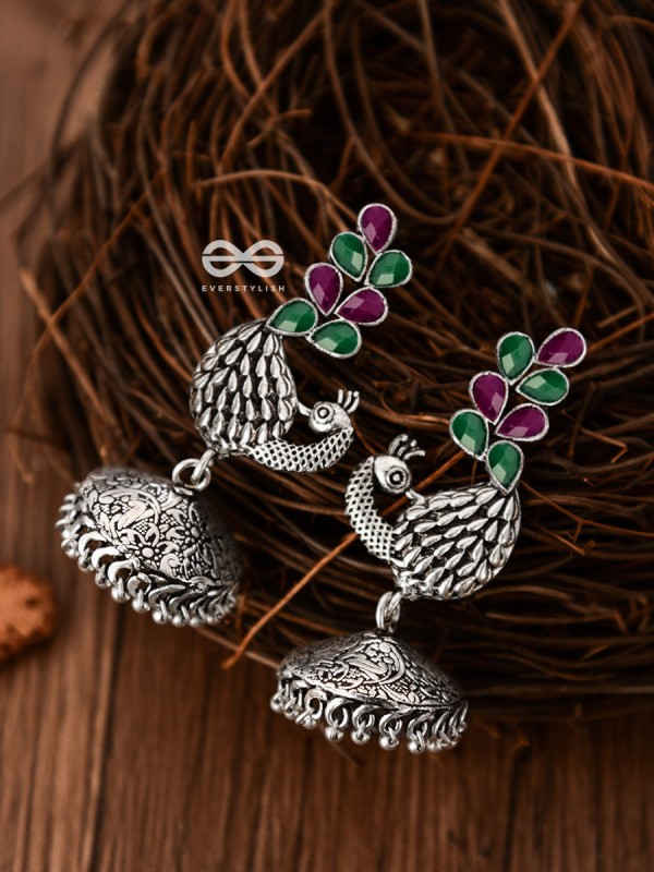 The Dancing Peacocks Engraved Jhumkis (Ruby Emerald) - Embellished Oxidised Collection