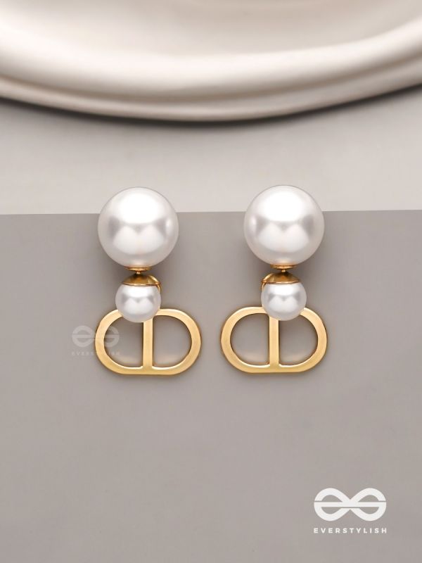 Starlit orb- dangling pearl earrings with golden spheres 