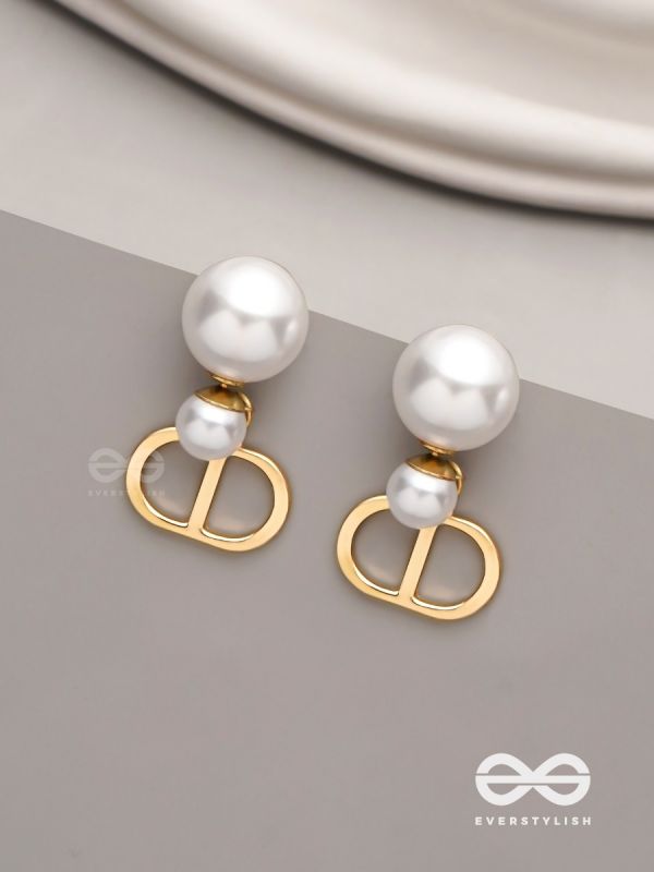 Starlit orb- dangling pearl earrings with golden spheres 