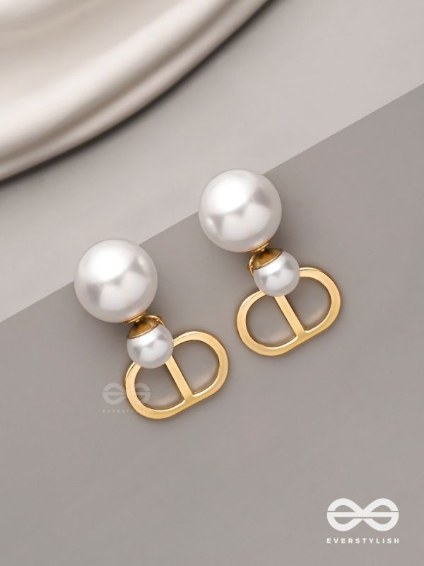 Starlit orb- dangling pearl earrings with golden spheres 