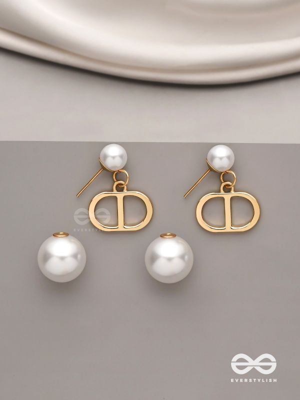 Starlit orb- dangling pearl earrings with golden spheres 