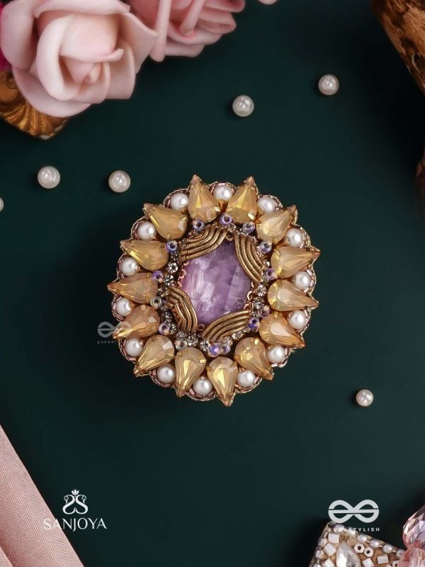 KANAKA PUSHPA – GOLDEN FLOWER EMBROIDERED FLOWER-SHAPED RING ADORNED WITH YELLOW GEMS AND PEARLS, GIVING A GOLDEN GLOW
