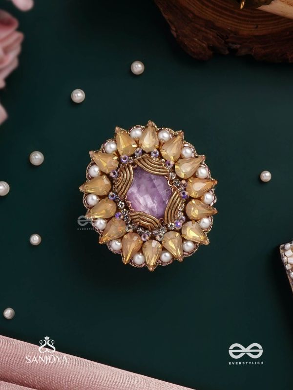 KANAKA PUSHPA – GOLDEN FLOWER EMBROIDERED FLOWER-SHAPED RING ADORNED WITH YELLOW GEMS AND PEARLS, GIVING A GOLDEN GLOW