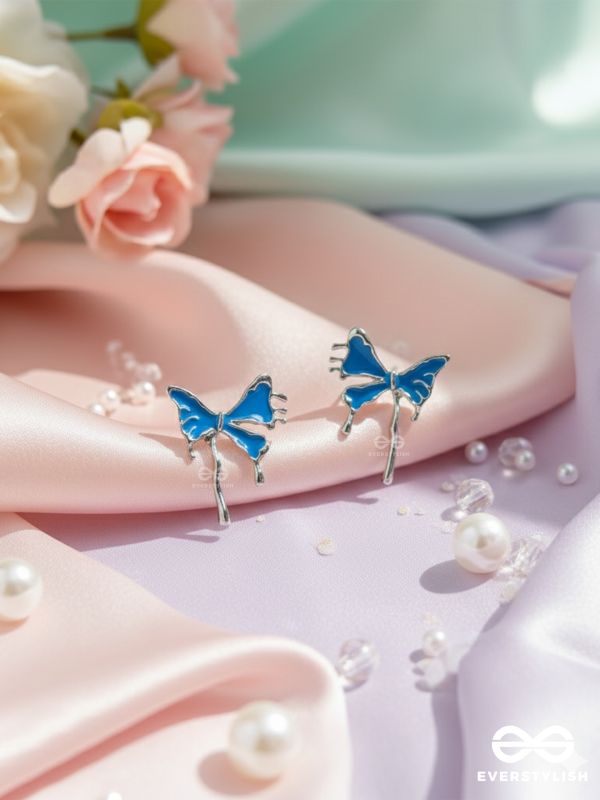FROSTY FLING – PLAYFUL BLUE BOW EARRINGS