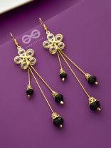The floral augmented charm- Golden dangler earrings
