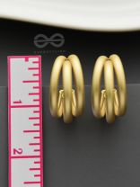 The Elegant Turns - Matte Finished Golden Hoops