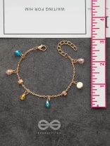 The Shimmering Sleet- Pearl and Crystals Studded Golden Bracelet