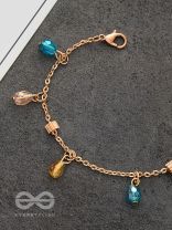 The Shimmering Sleet- Pearl and Crystals Studded Golden Bracelet