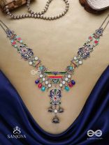 Prema raga- Love colour- Enamelled oxidized neckpiece embellished with beads, mirror and dangling jhumka.