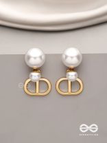 Starlit orb- dangling pearl earrings with golden spheres 