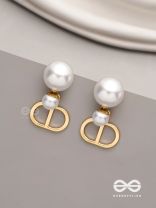 Starlit orb- dangling pearl earrings with golden spheres 